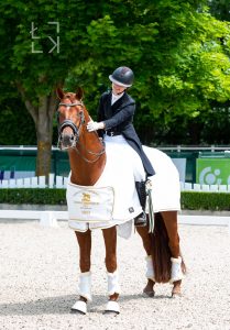Emma Caecilia Lienert and her horse Express celebrating their first international win together at the CDI Mariakalnok